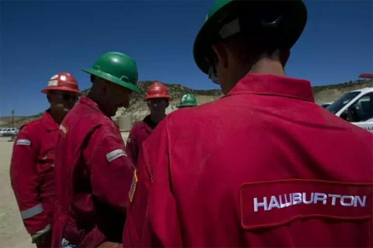 The image shows Halliburton Employees at a construction site.