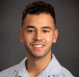 The image shows a photo of Jonathan Ascona, the Fall 2024 Scholarship Winner.